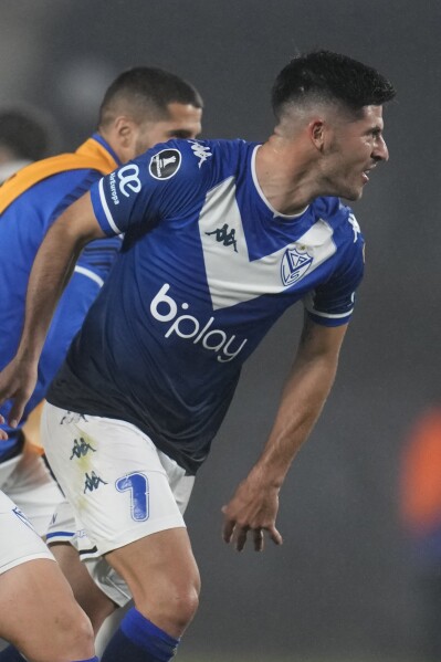 FILE - Jose Ignacio Florentin, of Velez Sarsfield, celebrates at the end of a Copa Libertadores soccer match in Buenos Aires, Argentina, July 6, 2022. A female journalist filed a complaint against Florentin and three other players from the Argentine soccer club Vélez Sarsfield saying they drugged and raped her on March 2 in Tucumán, Argentina. (AP Photo/Natacha Pisarenko, File)