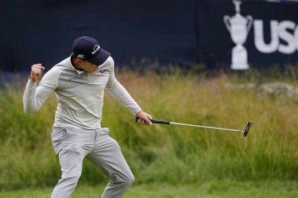 Matthew Fitzpatrick, of England, reacts after a putt on the 13th hole during the final round of the U.S. Open golf tournament at The Country Club, Sunday, June 19, 2022, in Brookline, Mass. (AP Photo/Julio Cortez)