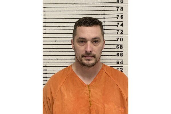 This undated photo provided by the Oregon Department of Corrections show Jesse Calhoun, who is a person of interest in the deaths of Webster; Smith, 22; Charity Lynn Perry, 24; and Ashley Real, 22, according to a law enforcement official who has knowledge of the investigation. They spoke on condition of anonymity because they were not authorized to comment publicly on the case. (Oregon Department of Corrections via AP)