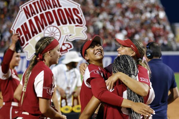 Oklahoma's Kinzie Hansen, Tiare Jennings, Rylie Boone and Jayda Coleman celebrate, from left, celebrate the team's win over Florida State in the NCAA Women's College World Series softball championship series Thursday, June 8, 2023, in Oklahoma City. (AP Photo/Nate Billings)