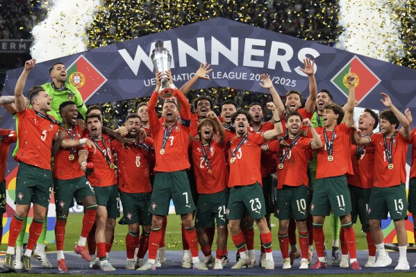 Portugal's Cristiano Ronaldo celebrates with teammates after winning the Nations League final soccer match between Portugal and Spain at the Allianz Arena in Munich, Germany, Monday, June 9, 2025. (AP Photo/Matthias Schrader)