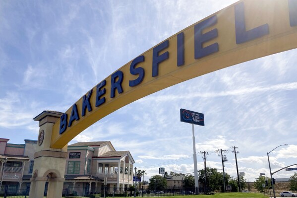 FILE - A sign for Bakersfield, Calif., is displayed over Sillect Avenue at Buck Owens Boulevard on April 20, 2022. Voters in California's 20th Congressional District can be forgiven if they open their ballots for Tuesday's election with a sense of déjà vu. Since former House Speaker Kevin McCarthy announced in December he would step down from his Central Valley seat, voters have already had two opportunities to vote for candidates to complete McCarthy's term and serve the next full one. (AP Photo/Lisa Mascaro)