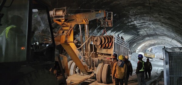 This photo provided by Uttarakhand State Disaster Response Force (SDRF) shows rescue work inside a collapsed road tunnel where 40 workers were trapped in northern in Uttarakhand state, India, Tuesday, Nov.14, 2023. ( SDRF via AP)