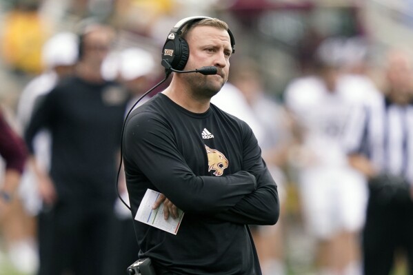FILE - Texas State coach Jake Spavital watches during the team's NCAA college football game against Baylor in Waco, Texas, Sept. 17, 2022. Spavital is leaving California, where he spent one season, to become the offensive coordinator and quarterbacks coach at Baylor, where coach and defensive specialist Dave Aranda was retained after a 3-9 season. (AP Photo/LM Otero, File)
