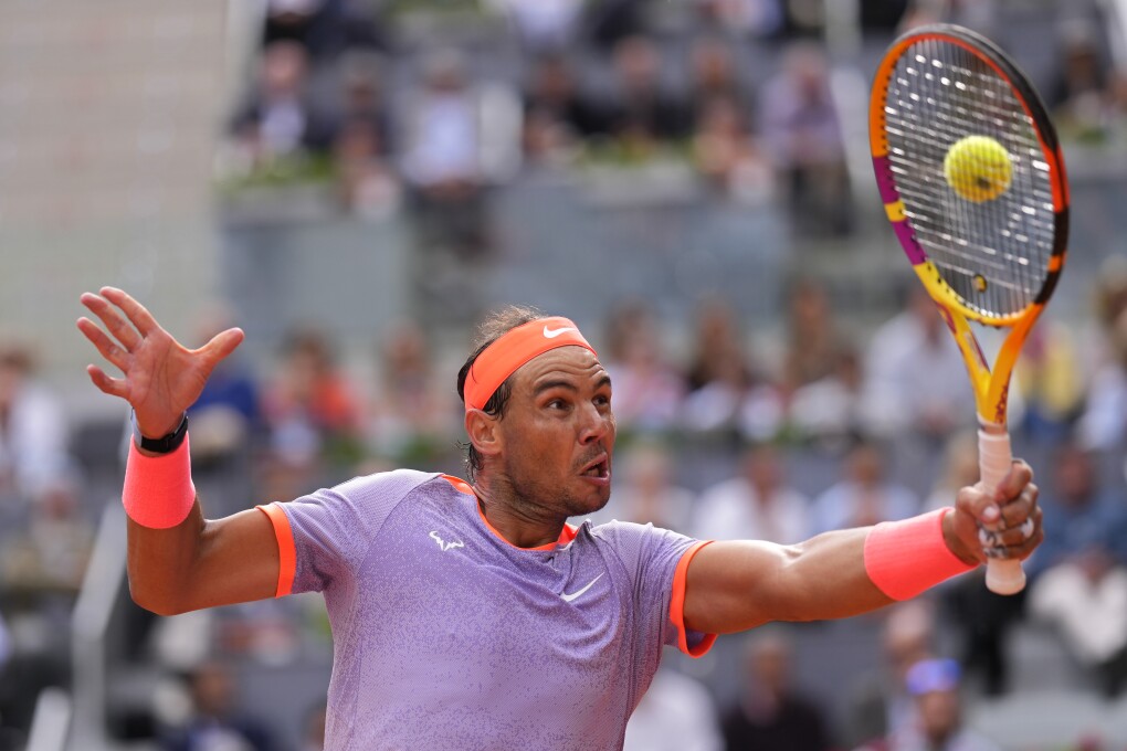 Rafael Nadal of Spain returns the ball to Pedro Cachin of Argentina during the Mutua Madrid Open tennis tournament in Madrid, Spain, Monday, April 29, 2024. (AP Photo/Manu Fernandez)