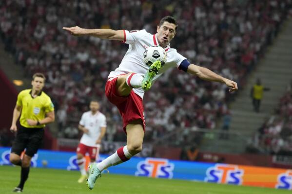 FILE Poland's Robert Lewandowski controls the ball during the World Cup 2022 group I qualifying soccer match between Poland and England, at the Narodowy stadium in Warsaw, Wednesday, Sept. 8, 2021.  
Poland is refusing to play its World Cup qualifier against Russia next month in response to Russia’s invasion of Ukraine, the Polish soccer federation president said Saturday, Feb, 26, 2022.  Poland striker Robert Lewandowski, the nation's all-time leading scorer, immediately responded to say it's the “right decision!” (AP Photo/Czarek Sokolowski, File)