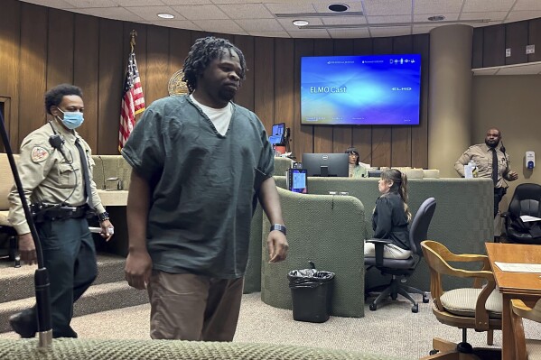 Cleotha Abston walks from the witness stand to his seat in a courtroom during his sentencing hearing for an April rape conviction on Friday, May 17, 2024, in Memphis, Tenn. Abston received 80 years in prison for kidnapping and raping a woman in September 2021, a year before he was charged with killing a Memphis school teacher. (AP Photo/Adrian Sainz)