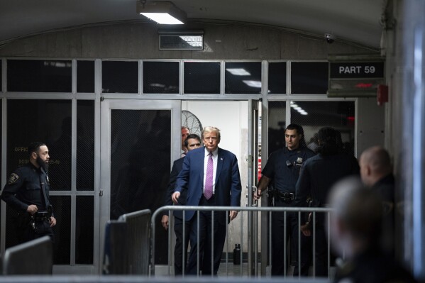 Former President Donald Trump steps outside the courtroom during a break at Manhattan criminal in New York, Friday, April 19, 2024.  (Maansi Srivastava/The New York Times via AP, Pool)
