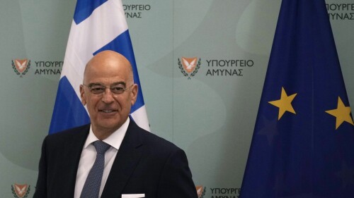 Greece's Defense Minister Nikos Dendias smiles before a press conference after a meeting with his Cypriot counterpart Michalis Georgallas at the Cypriot Defense Ministry in the capital Nicosia, Cyprus, on Thursday, July 6, 2023. Dendias, a former foreign minister of Greece, was on his first official overseas trip to Cyprus as defense minister following the re-election of Greek Prime Minister Kyriakos Mitsotakis last month. (AP Photo/Petros Karadjias)