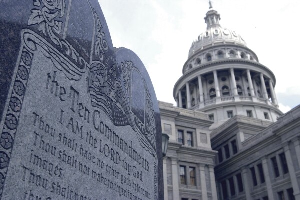 This 5-foot tall stone slab bearing the Ten Commandments stands near the Capitol in Austin, Texas, in this July 29, 2002 file photo. (AP Photo/Harry Cabluck, File)