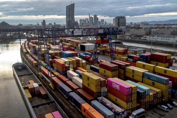 FILE - Containers are pictured in the small harbour in Frankfurt, Germany, Tuesday, Feb. 13, 2024. The German government said Europe's largest economy was in 鈥渢roubled waters鈥� and slashed its growth forecast for this year as it struggles with a lack of skilled labor, excessive bureaucracy, high interest rates and lagging investment in new projects 鈥� while a relatively modest set of tax breaks for business remains blocked in the legislature. (AP Photo/Michael Probst, File)