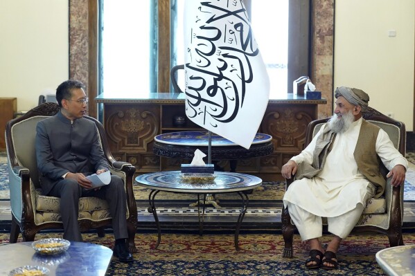 In this handout photo released by the Taliban Prime Minister Media Office, China's new ambassador to Afghanistan Zhao Sheng meets with Taliban Prime Minister Mohammad Hasan Akhund during the recognition ceremony at the Presidential Palace in Kabul, Afghanistan, Wednesday, Sept. 13, 2023. The Taliban on Wednesday greeted China's new ambassador to Afghanistan with pomp and ceremony, calling the envoy's nomination a significant step with a significant message. (Taliban Prime Minister Media Office via AP)