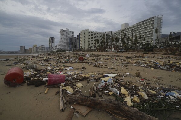 Debris lays on the beach after Hurricane Otis ripped through Acapulco, Mexico, Wednesday, Oct. 25, 2023. Hurricane Otis ripped through Mexico's southern Pacific coast as a powerful Category 5 storm, unleashing massive flooding, ravaging roads and leaving large swaths of the southwestern state of Guerrero without power or cellphone service. (AP Photo/Marco Ugarte)
