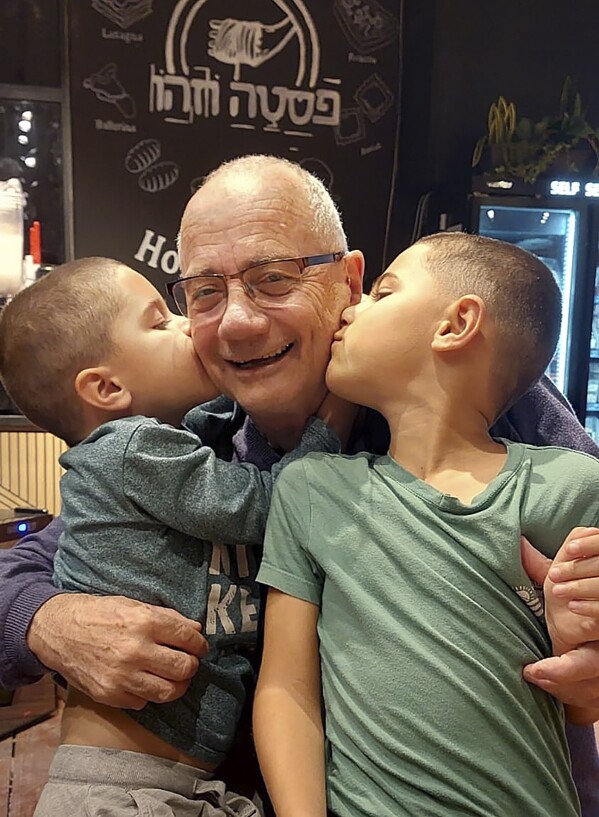 This undated photo shows Luis Har with two of his grandchildren in Israel. Har is one of the hostages taken during the attack by Hamas on Oct. 7, 2023. He was visiting a kibbutz near the Gaza border for a child's birthday party with his longtime partner, Clara Marman, when Hamas attacked. He was taken hostage along with Marman's brother Fernando Marman, her sister Gabriela Leimberg, and her niece, Mia Leimberg, 17. (Courtesy of Rinat Har via AP)