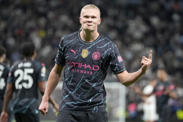 Manchester City's Erling Haaland celebrates scoring his side's second goal during the English Premier League soccer match between Tottenham Hotspur and Manchester City at Tottenham Hotspur Stadium in London, Tuesday, May 14, 2024.(AP Photo/Kin Cheung)