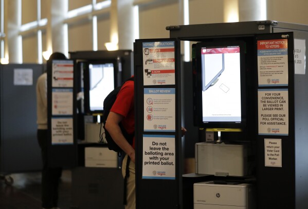 People vote at voting booths in the Georgia's primary election at Park Tavern June 9, 2020, in Atlanta. (AP Photo/Brynn Anderson, File)