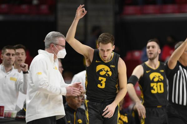Iowa guard Jordan Bohannon (3) gestures after he made a 3-point basket during the second half of the team's NCAA college basketball game against Maryland, Thursday, Feb. 10, 2022, in College Park, Md. (AP Photo/Nick Wass)