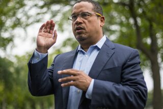 
              FILE - In this Aug. 17, 2017, file photo, U.S. Rep. Keith Ellison addresses campaign volunteers and supporters in Minneapolis. A lawyer investigating a claim by Ellison's ex-girlfriend, Karen Monahan that she was physically abused by Ellison in 2016 has concluded the allegation is unsubstantiated. The Associated Press on Monday, Oct. 1, 2018, obtained a draft of the report by Susan Ellingstad, an attorney hired by Minnesota's Democratic-Farmer-Labor Party to investigate the allegation. (Alex Kormann /Star Tribune via AP, File)
            