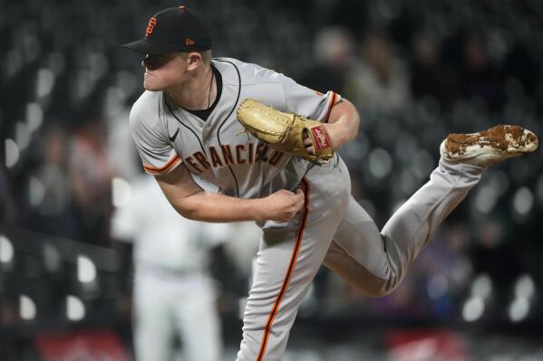 San Francisco Giants starting pitcher Logan Webb works against the Colorado Rockies during the sixth inning of a baseball game Wednesday, Sept. 21, 2022, in Denver. (AP Photo/David Zalubowski)