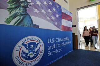 FILE - In this Aug. 17, 2018, file photo, people arrive before the start of a naturalization ceremony at the U.S. Citizenship and Immigration Services Miami Field Office in Miami. The number of applications for visas used in the technology industry soared for a second straight year, raising “serious concerns” that some are manipulating the system to gain an unfair advantage, authorities said Friday. There were 780,884 applications for H-1B visas in this year's computer-generated lottery, up 61% from 483,927 last year, U.S. Citizenship and Immigration Services said in a message to “stakeholders.” (AP Photo/Wilfredo Lee, File)