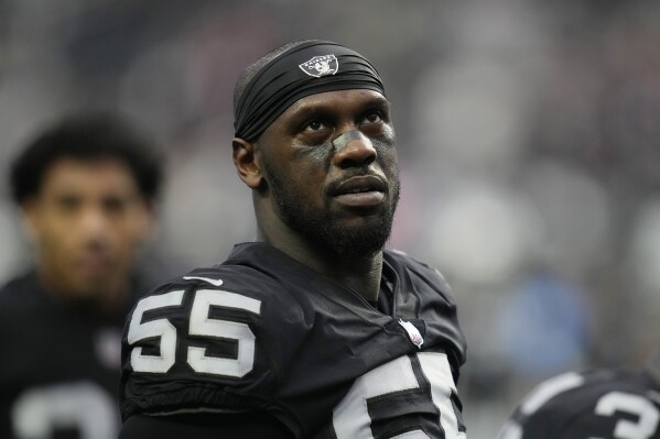 FILE - Las Vegas Raiders defensive end Chandler Jones warms up before an NFL football game against the New England Patriots, Dec. 19, 2022, in Las Vegas. The Raiders released defensive end Jones on Saturday, Sept. 30, ending a tumultuous final month with the club in which he lashed out several times on social media. (AP Photo/John Locher, File)