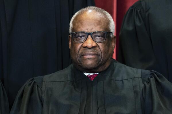 FILE - Supreme Court Justice Clarence Thomas sits during a group photo at the Supreme Court in Washington, April 23, 2021. (Erin Schaff/The New York Times via AP, Pool)