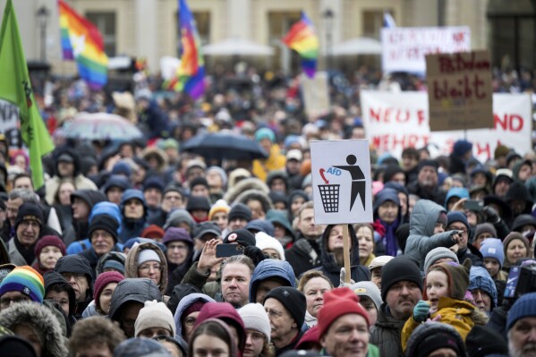 People stand on the Alter Markt square during the 