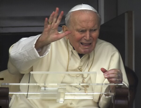 Pope John Paul II appears at a window of his rooms of the 10th floor of Rome's Gemelli Polyclinic Hospital, Sunday, March 13, 2005. (AP Photo/Andrew Medichini, File)