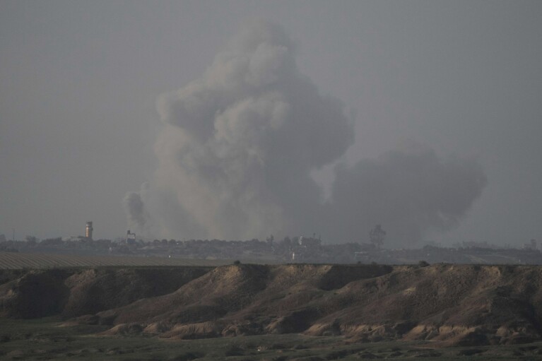 Smoke rises following an Israeli bombardment in the Gaza Strip, as seen from southern Israel, Monday, Dec. 25, 2023. The army is battling Palestinian militants across Gaza in the war ignited by Hamas' Oct. 7 attack into Israel. (AP Photo/Leo Correa)