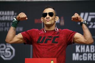 FILE - Tony Ferguson poses during a ceremonial weigh-in for the UFC 229 mixed martial arts fight, Friday, Oct. 5, 2018, in Las Vegas. UFC fighter Ferguson was arrested on a DUI charge in Hollywood early Sunday, May 7, 2023, after his truck slammed into several parked cars. (AP Photo/John Locher, File)