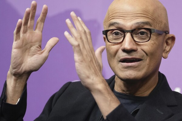 FILE - Microsoft CEO Satya Nadella speaks at an event at the Chatham House think tank in London, Jan. 15, 2024. Speaking to over 1,000 computer code developers in India’s ‘Silicon Valley’ Bengaluru, Thursday Nadella, asked them to use the company’s artificial intelligence tools that they are deploying across their products. (AP Photo/Kin Cheung, File)