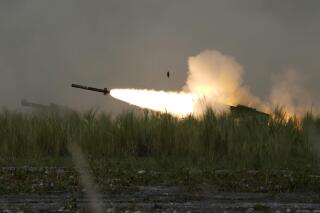 FILE - A U.S. M142 High Mobility Artillery Rocket System (HIMARS) fires a missile during annual combat drills between the Philippine Marine Corps and U.S. Marine Corps in Capas, Tarlac province, northern Philippines, on Oct. 13, 2022. Australia announced Thursday, Jan. 5, 2023, it will boost its defense capabilities by spending more than 1 billion Australian dollars ($700 million) on new advanced missile and rocket systems, including U.S.-made HIMARS which have been successfully used by Ukraine's military. (AP Photo/Aaron Favila, File)