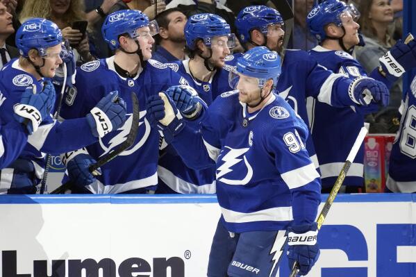 Tampa Bay Lightning center Steven Stamkos (91) celebrates with the bench after his goal against the Minnesota Wild during the third period of an NHL hockey game Tuesday, Jan. 24, 2023, in Tampa, Fla. (AP Photo/Chris O'Meara)