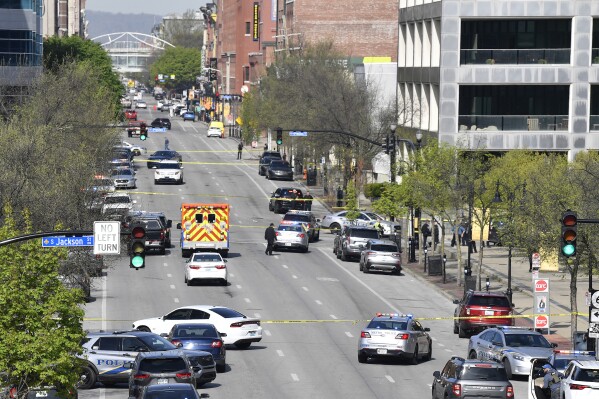 FILE - Louisville metro Police and emergency personnel block the streets outside of the Old National Bank building in Louisville, Ky., April 10, 2023. Struck by tragedy when one of his closest friends died in a mass shooting, Kentucky's Democratic governor supports a proposal meant to keep firearms away from people deemed as threats to themselves or others. His Republican challenger offers condolences for his rival's loss but opposes the measure. (AP Photo/Timothy D. Easley, file)