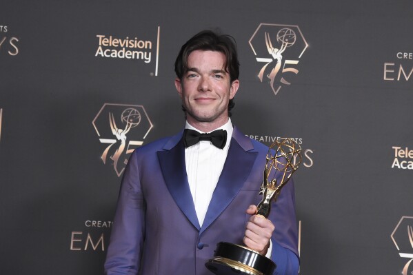 John Mulaney poses in the press room with the award for outstanding writing for a variety special for "Baby J" during night two of the Creative Arts Emmy Awards on Sunday Jan. 7, 2024, at the Peacock Theater in Los Angeles. (Photo by Richard Shotwell/Invision/AP)