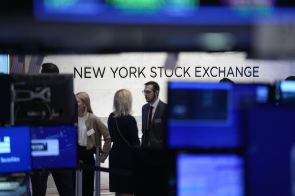 FILE - A sign is displayed on the floor of the New York Stock Exchange in New York, Wednesday, June 14, 2023. (AP Photo/Seth Wenig, File)