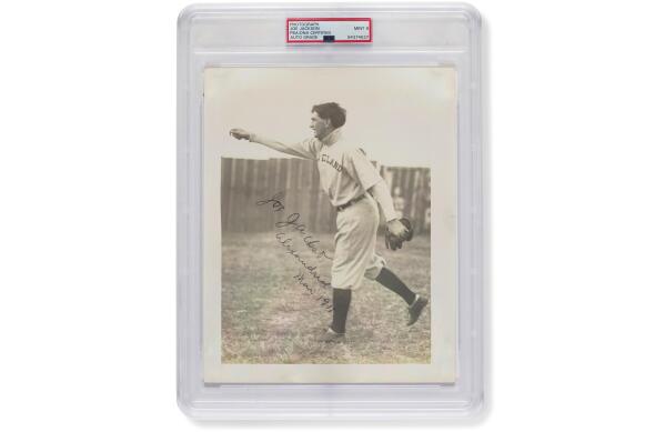 In a photo provided by Christie's and Hunt Auctions, an autographed photo of "Shoeless" Joe Jackson by Frank W. Smith is displayed. The photograph sold for $1.47 million, the most ever paid for a signed sports photograph. The photo was offered by Christie's and Hunt Auctions in New York in the auction Extra Innings: A Private Collection of Important Baseball Memorabilia. (Christie's and Hunt Auctions via AP)