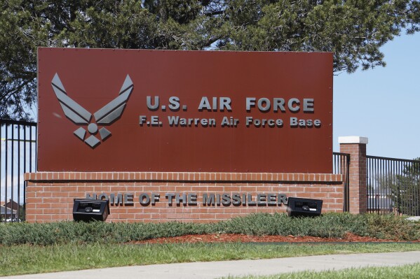 FILE - The entrance to F.E. Warren Air Force Base is pictured May 24, 2018, in Cheyenne, Wyo. President Joe Biden on Monday, May 13, 2024, issued an order blocking a Chinese-backed cryptocurrency mining firm from owning land near the Wyoming nuclear missile base. The order forces the divestment of property operated as a crypto mining facility near the base. (Ǻ Photo/Mead Gruver, File)
