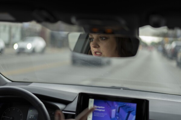 Jesse Johnson of the Family Resource Center drives a client to Walmart in Findlay, Ohio, Thursday, Oct. 12, 2023. The organization does outreach to people in jail and overdose survivors to help them guide them through addiction recovery. (AP Photo/Carolyn Kaster)