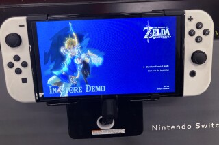 FILE - A Nintendo Switch console is seen at a retail store in Buffalo Grove, Ill., Thursday, Feb. 9, 2022. Nintendo is developing a live-action film based on its hit video game "The Legend of Zelda," the Japanese maker behind the Super Mario franchise said Wednesday, Nov. 8, 2023. (AP Photo/Nam Y. Huh, File)