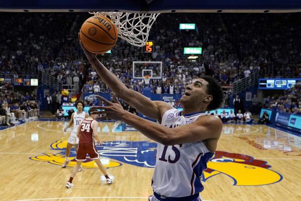 Kansas guard Kevin McCullar Jr. puts up a shot during the first half of an NCAA college basketball game against Oklahoma Tuesday, Jan. 10, 2023, in Lawrence, Kan. (AP Photo/Charlie Riedel)