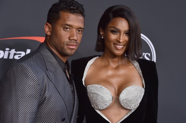 FILE - NFL player Russell Wilson of the Denver Broncos, left, and Ciara arrive at the ESPY Awards on Wednesday, July 20, 2022, at the Dolby Theatre in Los Angeles. The Grammy-award winning performer Ciara is expecting her fourth child, her third with husband and Denver Broncos quarterback Russell Wilson. (Photo by Jordan Strauss/Invision/AP, File)