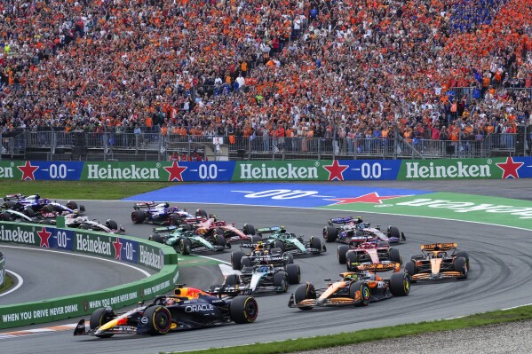FILE - Red Bull driver Max Verstappen of the Netherlands leads the field after the start of the Formula One Dutch Grand Prix race at the Zandvoort racetrack, Netherlands, Sunday, Aug. 25, 2024. (AP Photo/Peter Dejong, File)