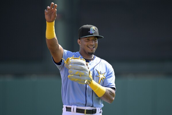 FILE - Tampa Bay Rays' Wander Franco warms up before a spring training baseball game against the New York Yankees, Tuesday, Feb. 28, 2023, in Kissimmee, Fla. Franco gets the 13th-highest bonus at $706,761, in the $50 million pool for pre-arbitration players, according to figures compiled by Major League Baseball and the players’ association. (AP Photo/Phelan M. Ebenhack, File)