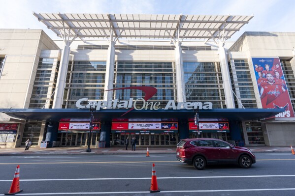 Capital One Arena is shown before an NHL hockey game between the Washington Capitals and the New Jersey Devils, Tuesday, Feb. 20, 2024, in Washington. The proposed move of the Capitals and Wizards sports teams to nearby Virginia has stoked concern in a pair of fragile Washington neighborhoods. Residents and business owners in Chinatown fear that the departure of the teams would devastate the neighborhood around the Capital One Arena. (AP Photo/Alex Brandon)