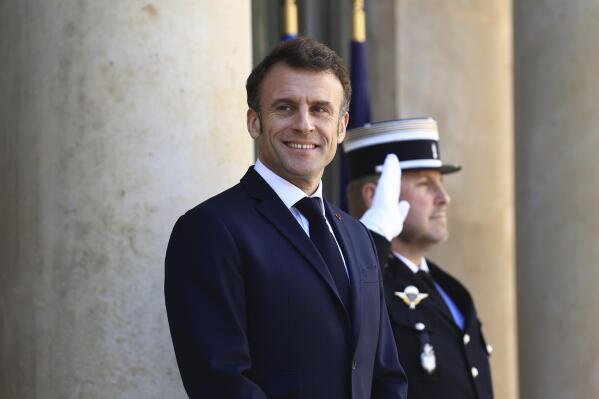 French President Emmanuel Macron waits for European Commission president Ursula van der Leyen before a working lunch, Monday, April 3, 2023 at the Elysee Palace in Paris. The two leaders will travel to China later this week. (AP Photo/Aurelien Morissard)