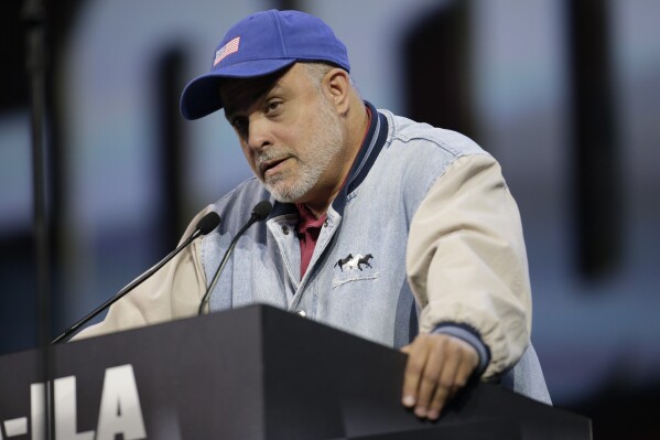 FILE - Radio host Mark Levin speaks during the leadership forum at the National Rifle Association's annual convention, April 25, 2014, in Indianapolis. Two cable news personalities from the complete opposite ends of the political spectrum — Levin and Jen Psaki — are increasing their presence on television. Levin, the radio talk host whose TV show “Life, Liberty & Levin” airs Sunday nights on Fox News Channel, will have an additional weekend hour on Saturdays, Fox said. It will air in the same 8 p.m. time slot on both weekend nights. (AP Photo/AJ Mast, File)