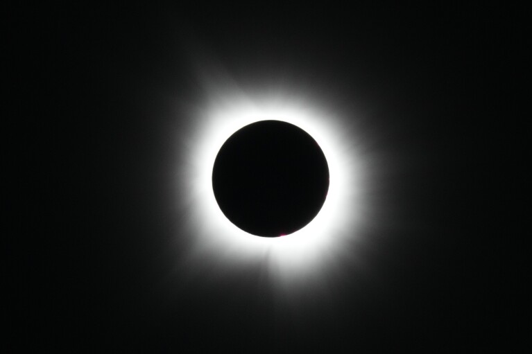 A total solar eclipse is seen from Arlington, Texas, Monday, April 8, 2024. (AP Photo/Julio Cortez)