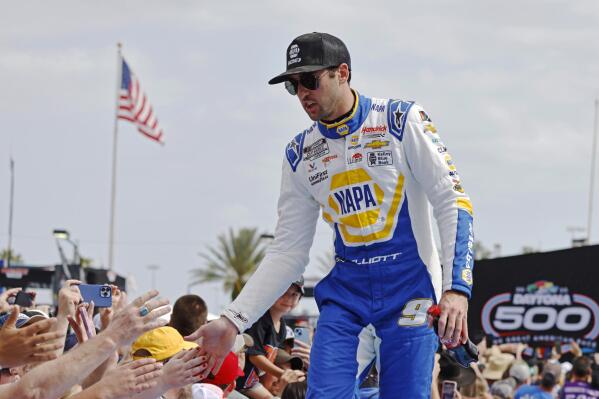 FILE - Chase Elliott greets fans during driver introductions before the NASCAR Daytona 500 auto race at Daytona International Speedway on Feb. 19, 2023, in Daytona Beach, Fla. Elliott has injured his leg in a snowboarding accident in Colorado and will miss this weekend’s NASCAR race at Las Vegas. Hendrick Motorsports said NASCAR’s most popular driver was scheduled to have surgery Friday evening. Elliott was injured Friday, March 3. (AP Photo/Terry Renna, File)