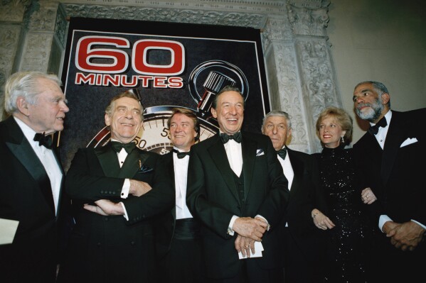 FILE - In this Nov. 10, 1993 file photo, The "60 Minutes" team, from left, Andy Rooney, Morley Safer, Steve Kroft, Mike Wallace, executive producer Don Hewitt, Lesley Stahl, and Ed Bradley pose at the Metropolitan Museum of Art in New York celebrating their 25th anniversary. CBS says Kroft, 73, will retire from the news magazine at Sunday’s season finale. (AP Photo/Mark Lennihan, File)